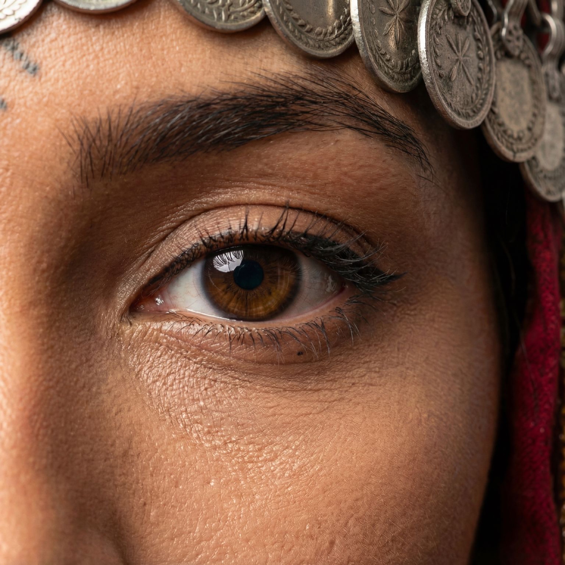 Close-up eye portrait with Amazigh silver crown